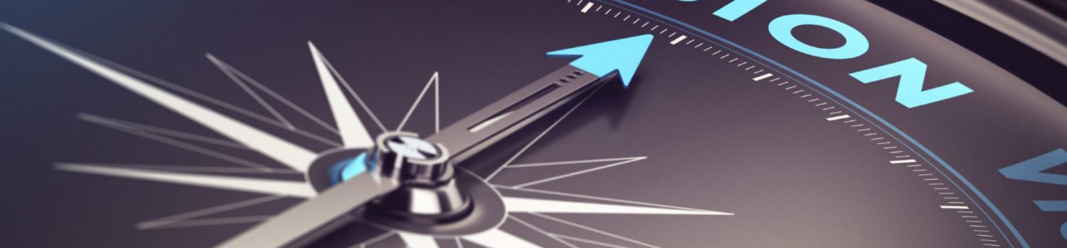 Compass needle pointing to the word "vision"