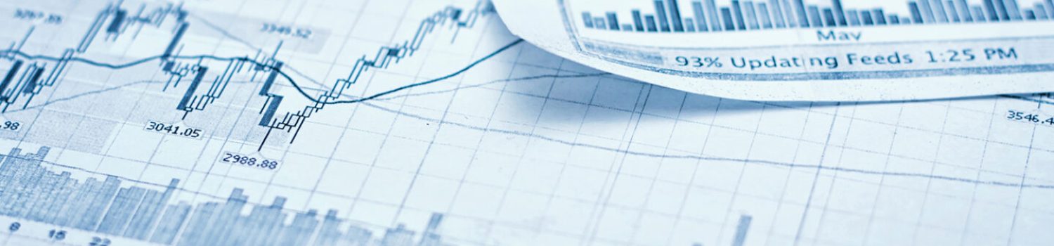 Printed stock market charts and data graphs