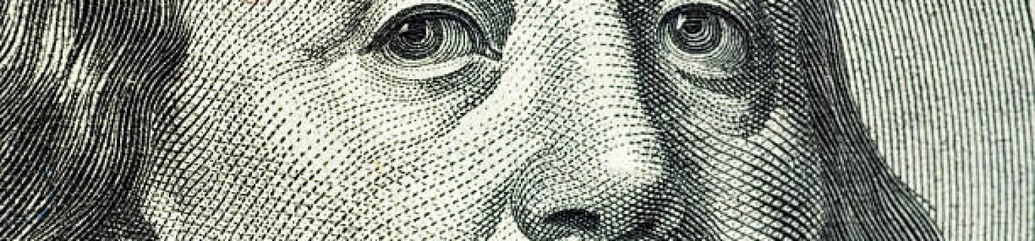 Close-up of Benjamin Franklin on the 100 dollar bill.