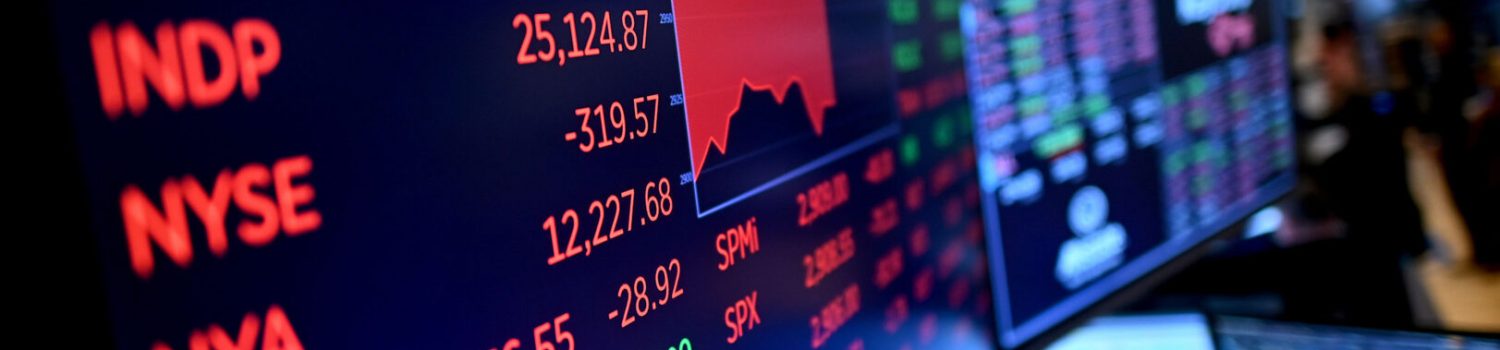 Red stock market numbers on trading display