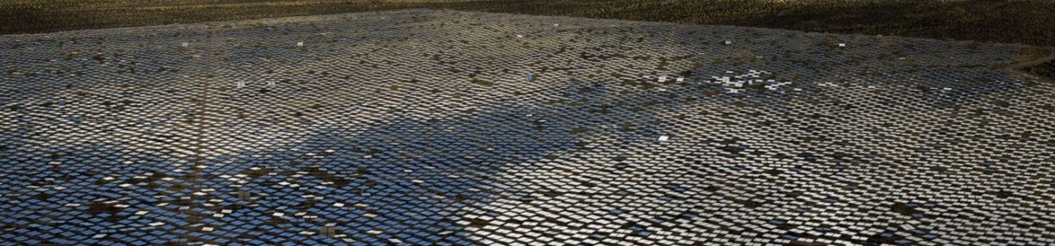 Operations At The Ivanpah Solar Electric Generating System vast solar mirror field in desert valley